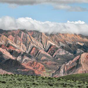 Breathtaking view of the colorful Serrania de Hornocal mountain range covered in clouds in Humahuaca, Jujuy, Argentina.