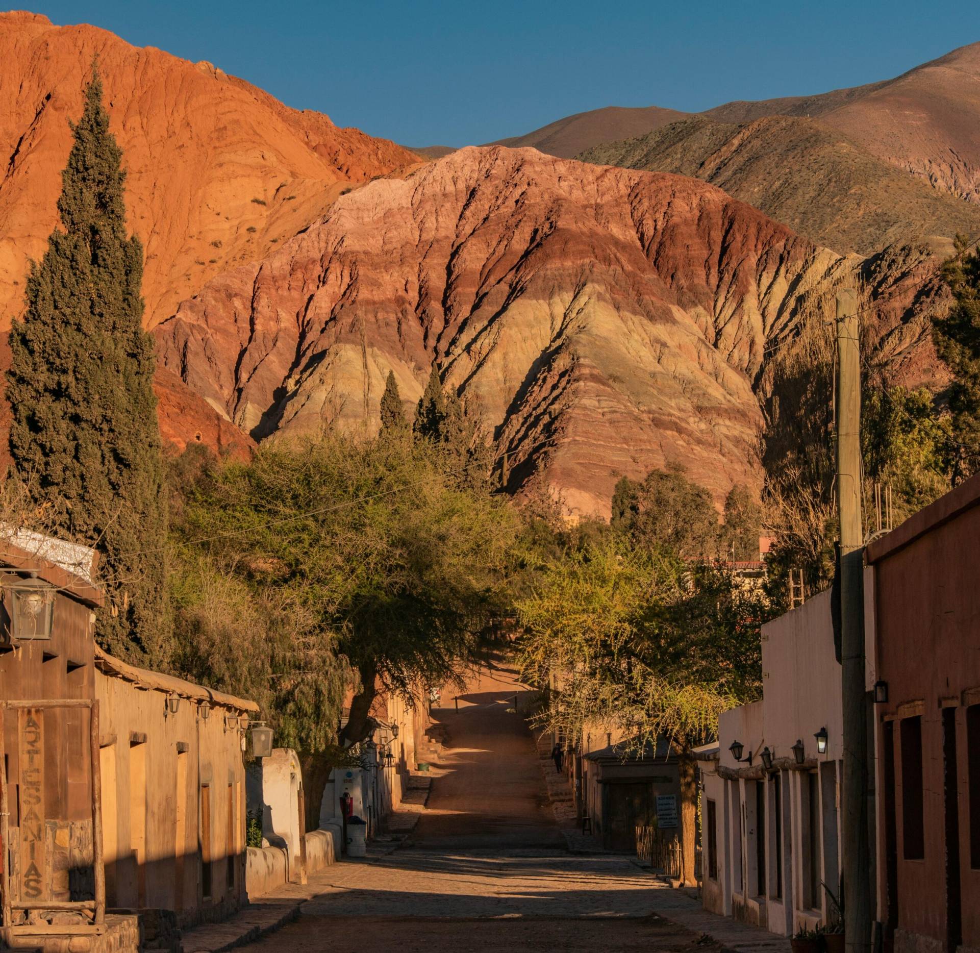 View of the vibrant mountains and quaint street in Purmamarca, Jujuy, Argentina.